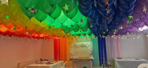 The Olive Branch Rainbow Room, with a ceiling of balloons styled to look like a rainbow